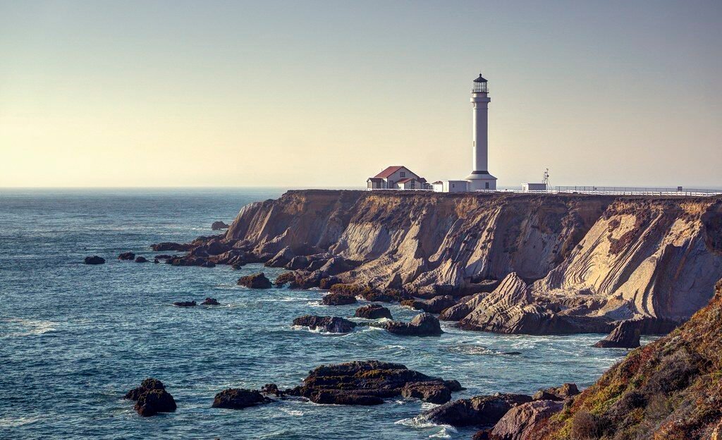 a cliff with trees on it